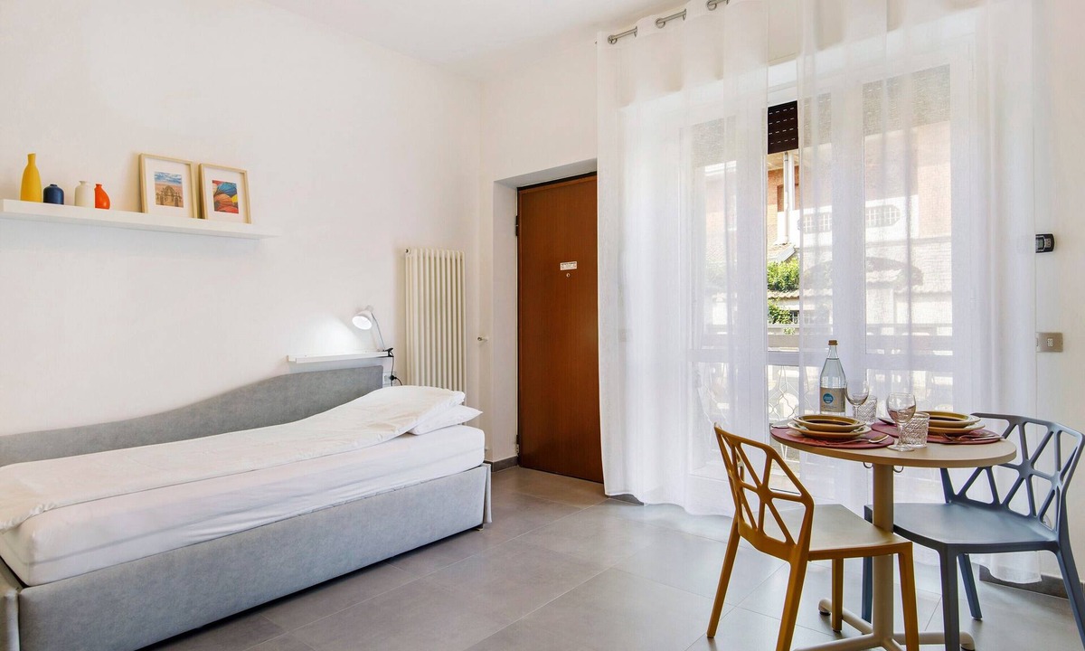 Caronno Pertusella Apartment | Studio Apartment 'La Casa Di Angela' with Private Garden, Wi-Fi and Air Conditioning