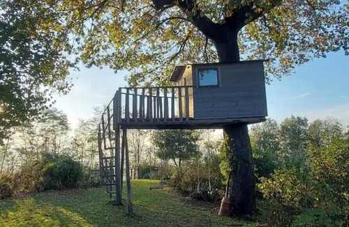 Samone House | A charming stone house set in a hillside garden