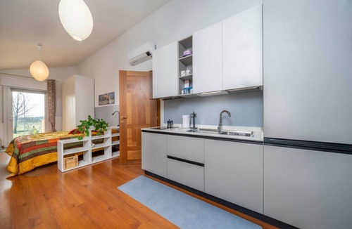 Udine House | A comfortable and bright 40 sq m studio apartment, perfect for two people, located on the first floor of a small villa (no elevator).The property is located in an extremely quiet area surrounded by greenery, with a cycle path nearby. Guests can easily re