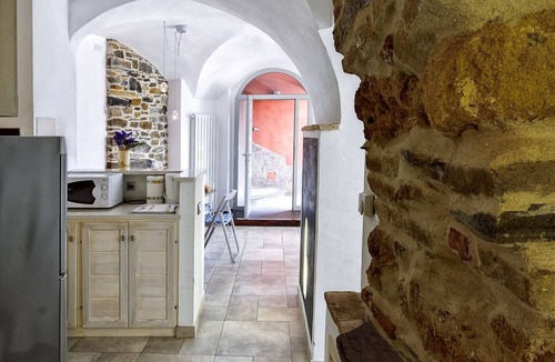 Civezza Condo | Casa Pisani in a building with garden and swimming pool