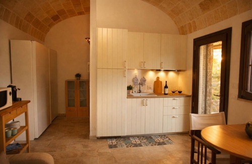 Cenate Apartment | Casina Matilde is a charming retreat carved into an ancient tuff quarry, with walls that tell stories from distant times. This gem, featuring its characteristic barrel vaults, offers a bright furnished veranda for moments of pure stillness, a spacious ro