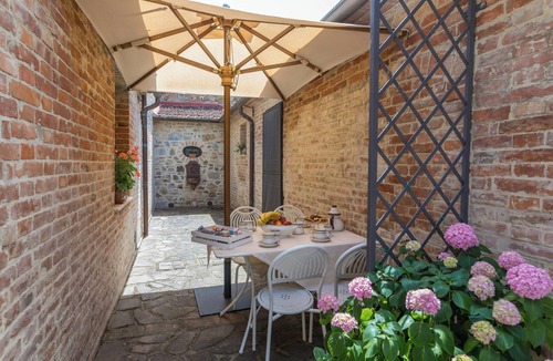 Cetona Apartment | Cozy flat with pool and cypress view in Cetona