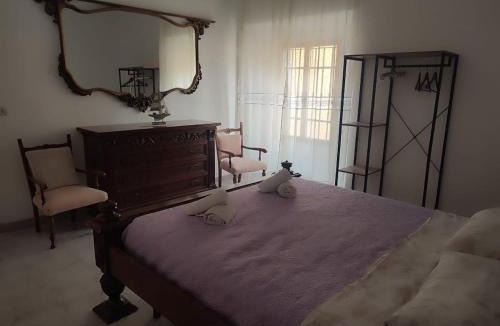 Galtelli House | Family&Friends 1 - Ground Floor 2-Room Guest Suite - Natural Stone Wall Cooling twin room and large lounge with real beds - fully equipped & minutes from the sea & beach