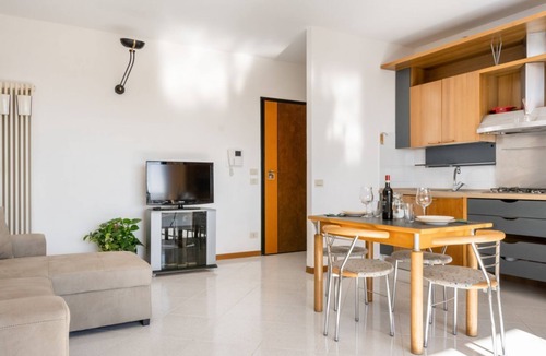 Ponte San Giovanni Apartment | GuestHost - Bright 80 sqm apartment that can accommodate up to 6 people, located near the Ponte San Giovanni station. It consists of a living room with kitchen and dining area, a bathroom and two bedrooms. The flat is located on the ninth floor and has a