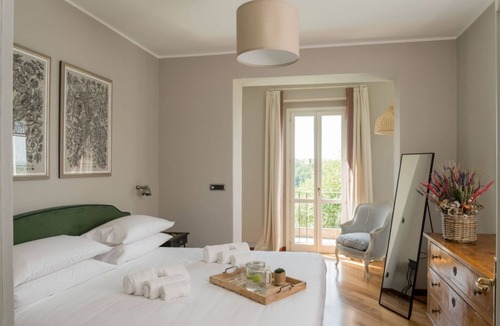 Vignale Monferrato Apartment | GuestHost - Elegant and spacious villa perfect for accommodating up to 12 guests is located in the center of Vignale in the heart of Monferrato area, nominated a UNESCO World Heritage Site in 2014. The house is equipped with every comfort: WiFi, air cond