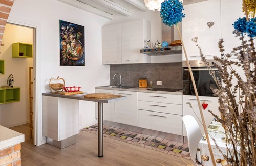 Castello di Brussa Apartment | Studio Apartment 'Appartamento Brussa Beach' with Private Terrace, Wi-Fi and Air Conditioning