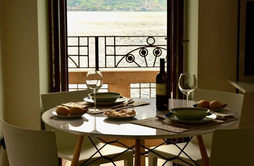 Lovere Old Town Apartment | Stylish Lakefront House is a beautiful and spacious 2 bedroom apartment, with plenty of light coming from the big and many windows overlooking the lake and the harbor, the apartment boasts a Spacious lounge with breathtaking lake view where you can lay d