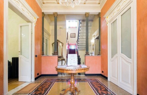Quinto al Mare Villa | The Riviera apartment, located on the ground floor of Villa Aranci in Via Fabio Filzi 2B, Genoa, offers an elegant and comfortable stay in an exclusive setting.With a private entrance, double bedroom, living area, private bathroom, and direct access to t