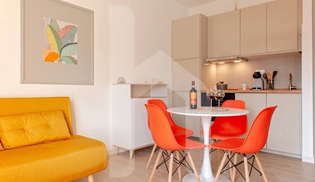 HOMIDAY offers a fully renovated apartment with brand-new interiors.Guests have access to a modern kitchen and a comfortable living room with a small balcony featuring two seats.The apartment also includes a double bedroom and a bathroom, both completely