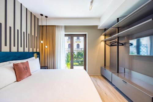 MH SUITES Plebiscito