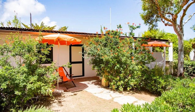 Property in a holiday village 'Baia Falcone-Bilocale 403' with sea view and air conditioning