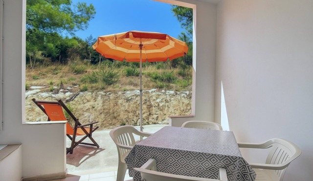 Property in the holiday village 'Baia Falcone - Standard 308' with sea view and air conditioning